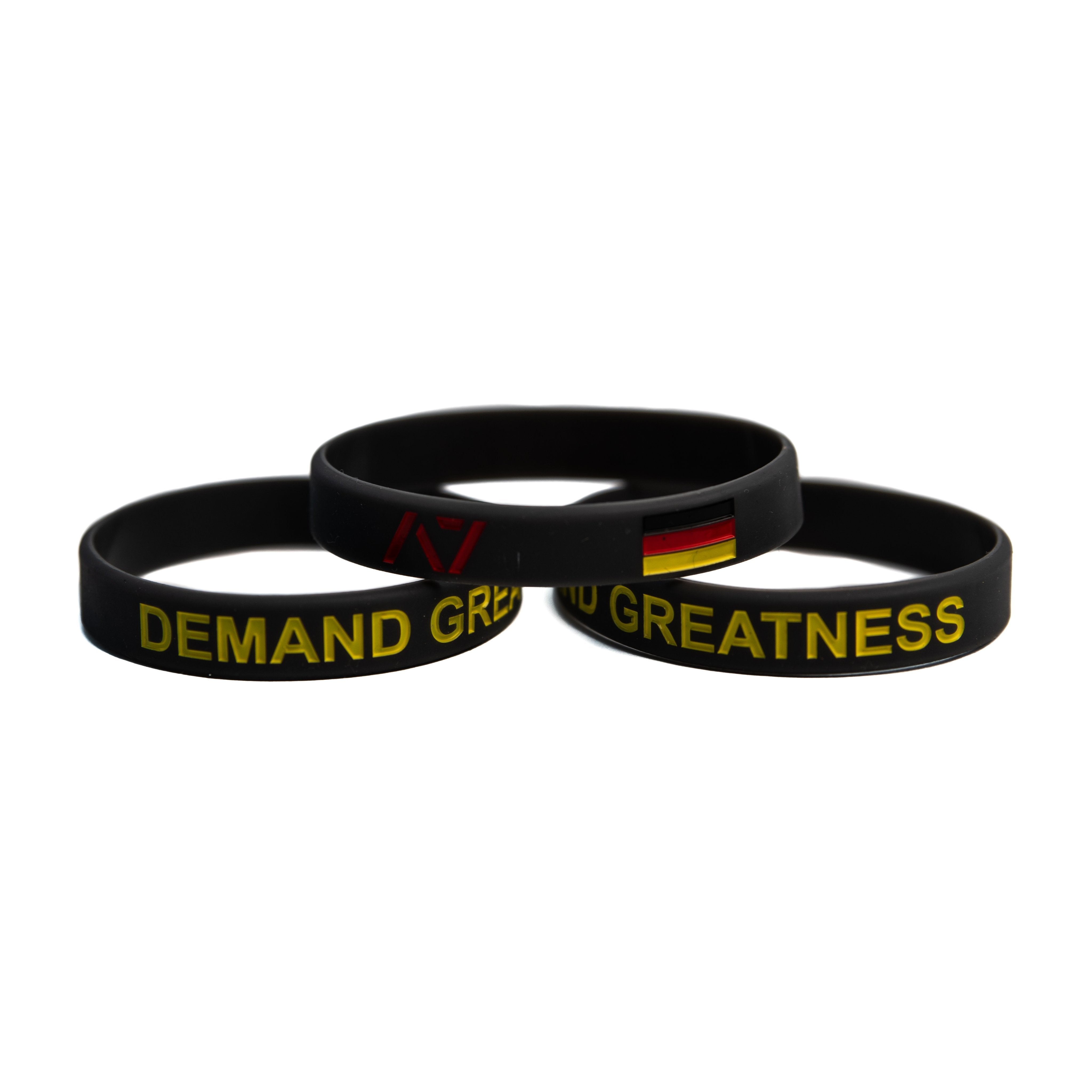 You are always working towards your goals and helping others reach their full potential. Feel the German spirit with this country wristband design that incorporates the German flag into a wristband and reminds you to always Demand Greatness. The wristband is 1/2 inch wide and features black debossed lettering.