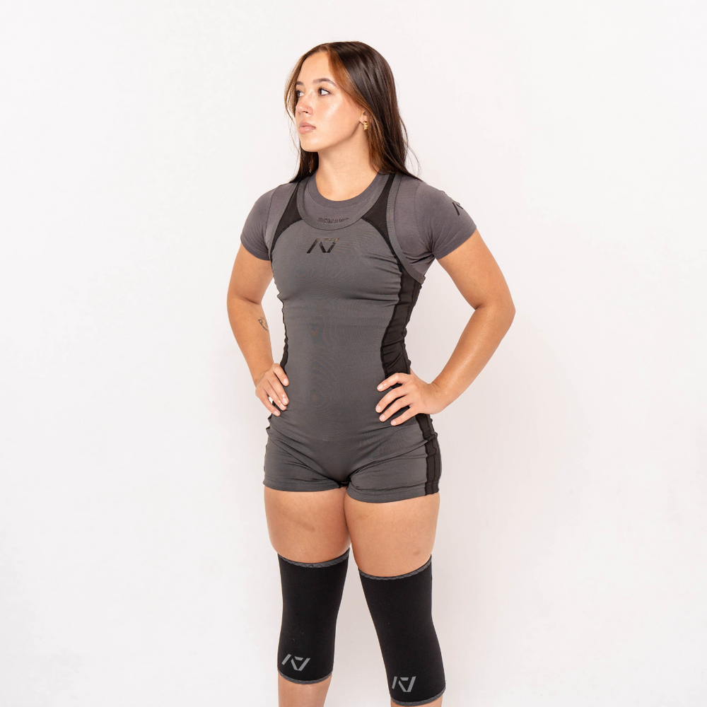 
                      
                        A7 IPF Approved Shadow Stone Grey Luno singlet features extra lat mobility, side panel stitching to guide the squat depth level and curved panel design for a slimming look. The Women's cut singlet features a tapered waist and additional quad room. The IPF Approved Kit includes Luno Powerlifting Singlet, A7 Meet Shirt, A7 Zebra Wrist Wraps, A7 Deadlift Socks, Hourglass Knee Sleeves (Stiff and Rigor Mortis Knee Sleeves). All A7 Powerlifting Equipment shipping to UK, Norway, Switzerland and Iceland.
                      
                    