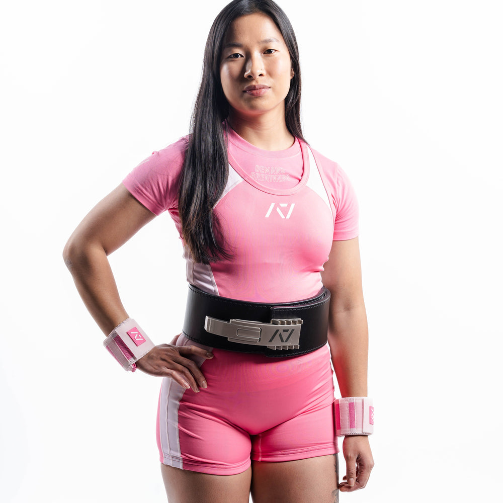 
                      
                        A7 IPF Approved Roseite Luno singlet features extra lat mobility, side panel stitching to guide the squat depth level and curved panel design for a slimming look. The Women's cut singlet features a tapered waist and additional quad room. The IPF Approved Kit includes Luno Powerlifting Singlet, A7 Meet Shirt, A7 Zebra Wrist Wraps, A7 Deadlift Socks, Hourglass Knee Sleeves (Stiff and Rigor Mortis Knee Sleeves). All A7 Powerlifting Equipment shipping to UK, Norway, Switzerland and Iceland.
                      
                    