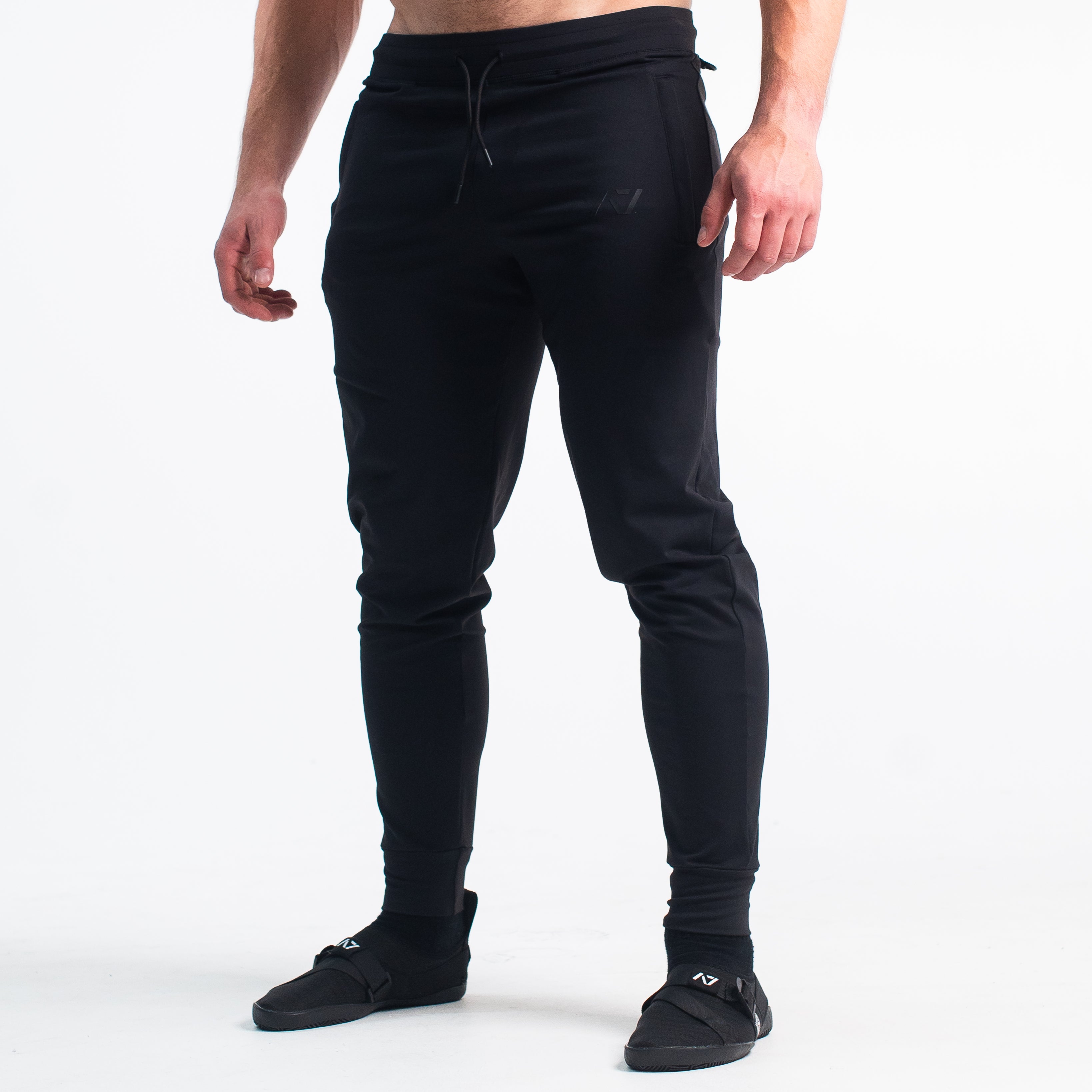 Defy joggers are just as comfortable in the gym as they are going out. These are made with premium moisture-wicking 4-way-stretch material for greater range of motion. These are a great fit for both men and women and offer deep zippered pockets and tapered leg design. Purchase Gold Standard Defy Joggers from A7 UK shipping to UK or A7 Europe shipping to EU.