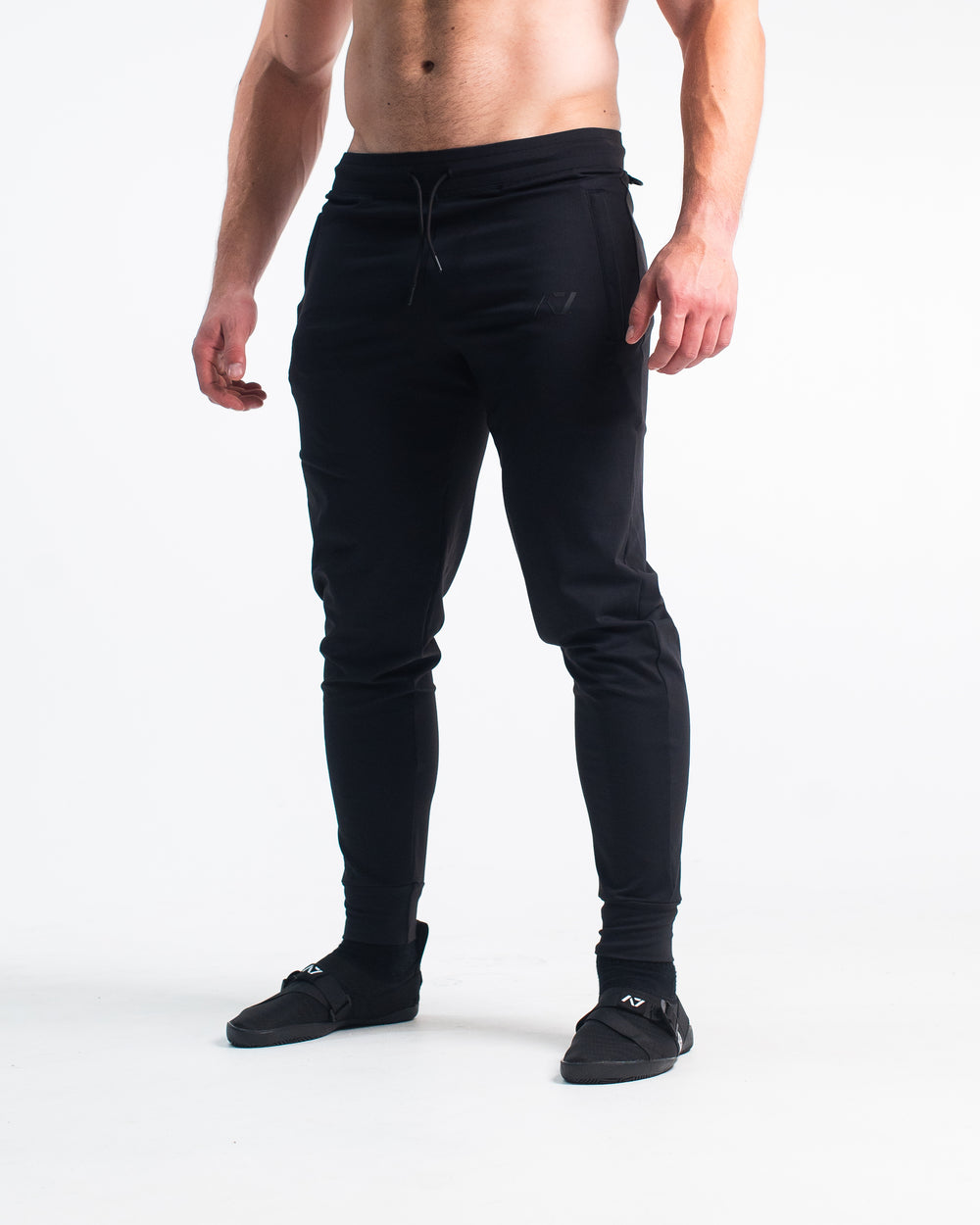 Defy joggers are just as comfortable in the gym as they are going out. These are made with premium moisture-wicking 4-way-stretch material for greater range of motion. These are a great fit for both men and women and offer deep zippered pockets and tapered leg design. Purchase Gold Standard Defy Joggers from A7 UK shipping to UK or A7 Europe shipping to EU.