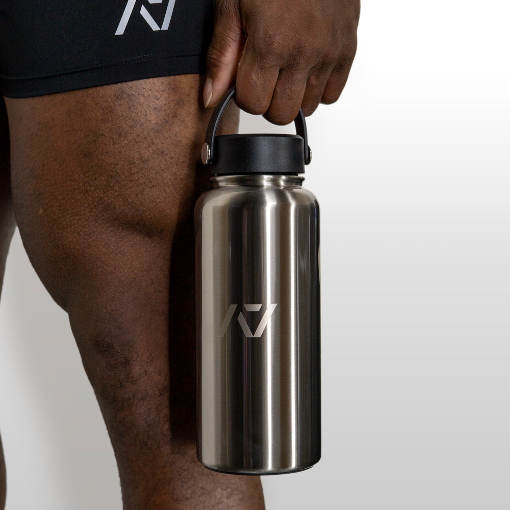 Our 32oz Insulated Stainless Steel Water Bottle in sleek stainless steel is designed to keep up with your toughest training days, long commutes, and everything in between. With a generous 32 oz capacity, you'll have plenty of hydration on hand to power through any challenge. All A7 Powerlifting Equipment shipping to UK, Norway, Switzerland and Iceland.
