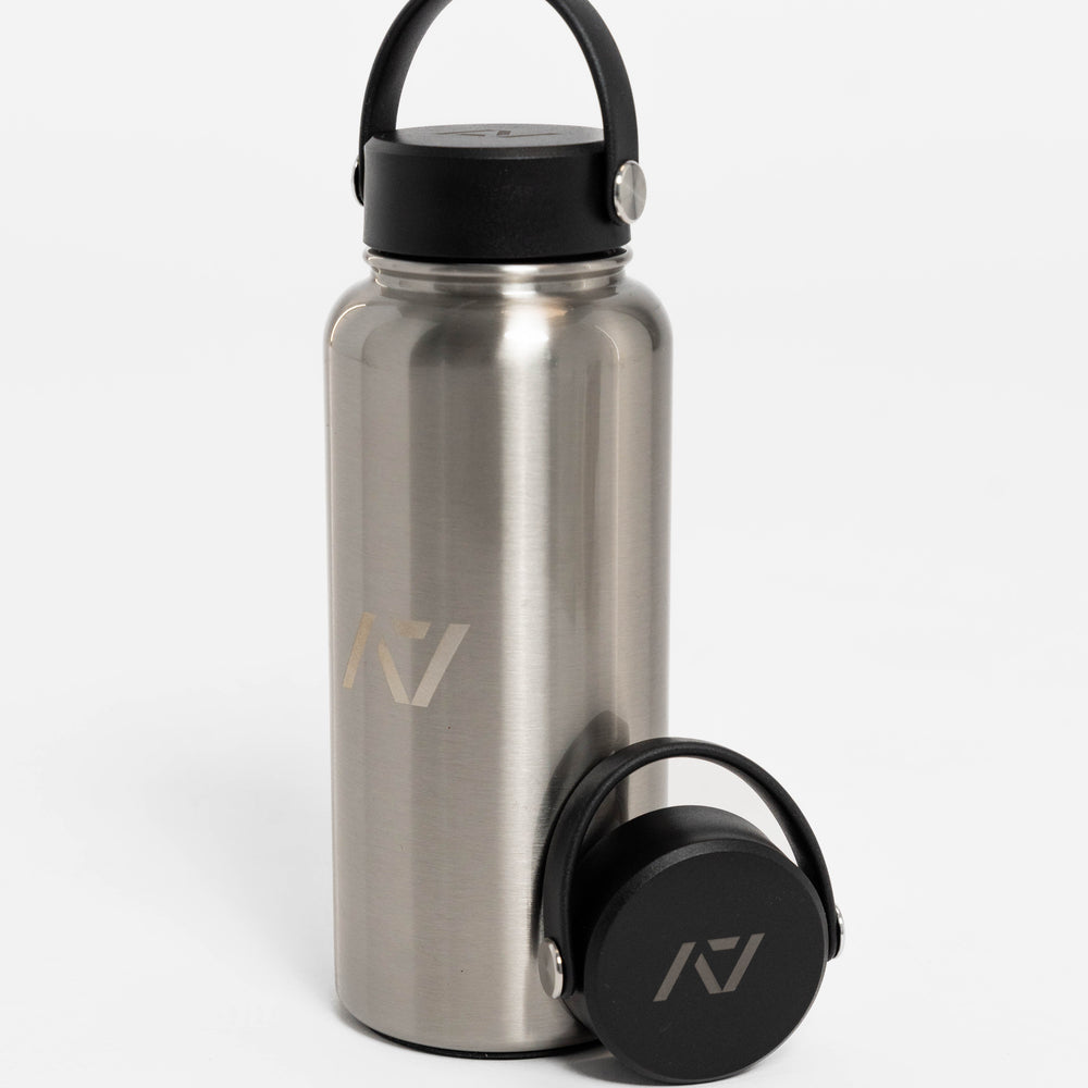 Our 32oz Insulated Stainless Steel Water Bottle in sleek stainless steel is designed to keep up with your toughest training days, long commutes, and everything in between. With a generous 32 oz capacity, you'll have plenty of hydration on hand to power through any challenge. All A7 Powerlifting Equipment shipping to UK, Norway, Switzerland and Iceland.