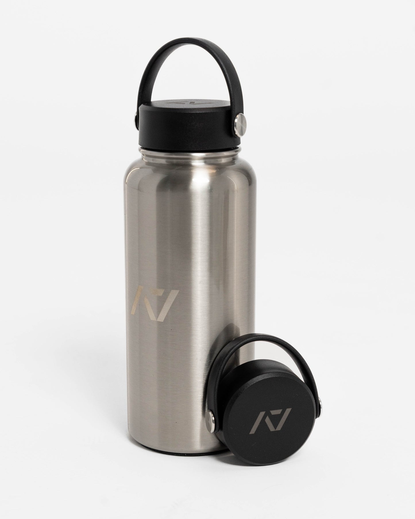 Our 32oz Insulated Stainless Steel Water Bottle in sleek stainless steel is designed to keep up with your toughest training days, long commutes, and everything in between. With a generous 32 oz capacity, you'll have plenty of hydration on hand to power through any challenge. All A7 Powerlifting Equipment shipping to UK, Norway, Switzerland and Iceland.