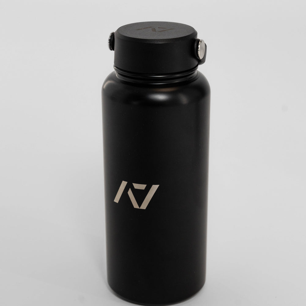 Our 32oz Insulated Stainless Steel Water Bottle in sleek black is designed to keep up with your toughest training days, long commutes, and everything in between. With a generous 32 oz capacity, you'll have plenty of hydration on hand to power through any challenge. All A7 Powerlifting Equipment shipping to UK, Norway, Switzerland and Iceland.