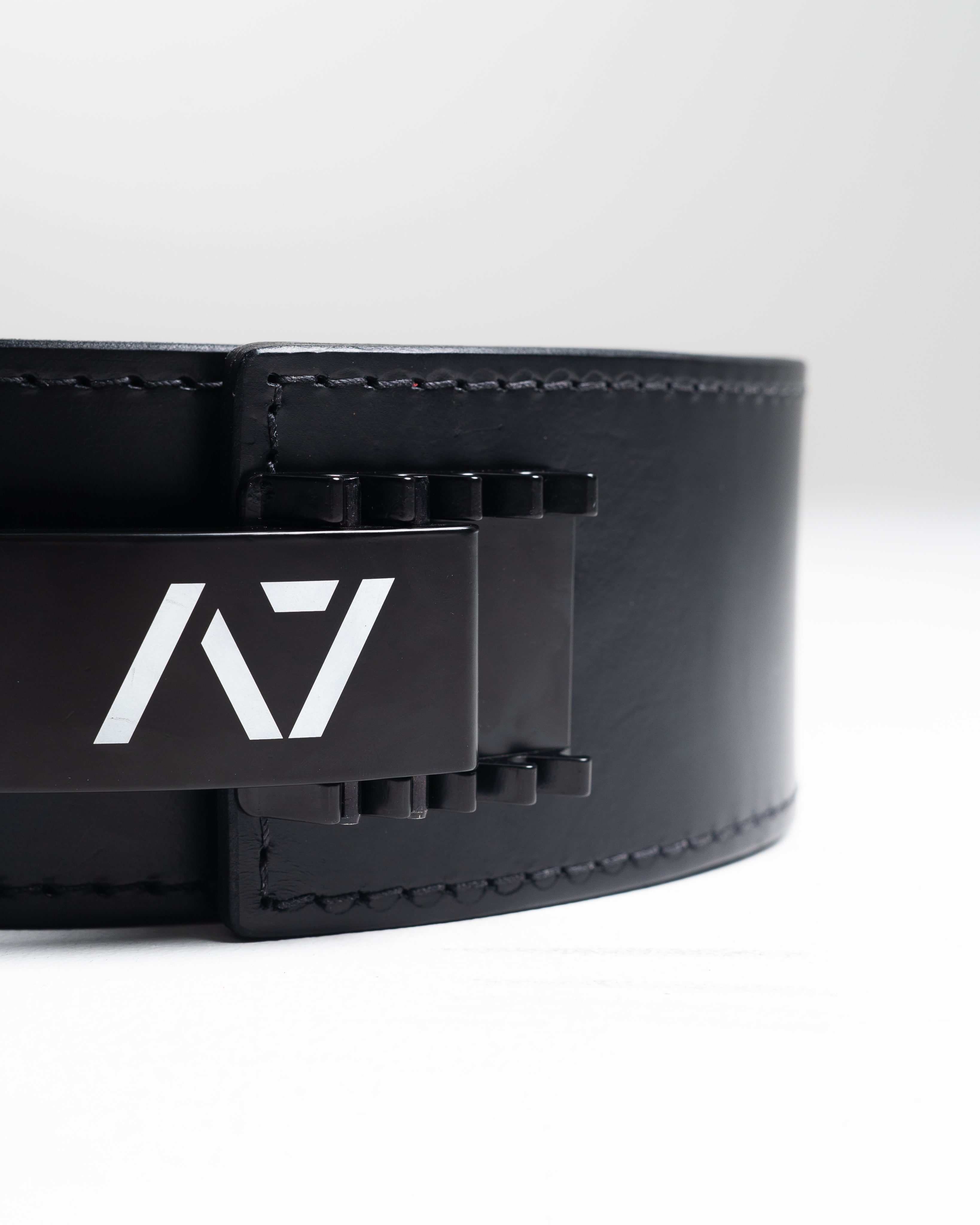 A7 IPF Approved PAL Lever Belt features a black design with black leather, black engraved buckle and debossed A7 logo on the leather. The new Pioneer Adjustable Lever, PAL, buckle allows you to quickly adjust the tightness of your belt for a perfect fit. The IPF Approved Kit includes Singlet, A7 Meet Shirt, A7 Zebra Wrist Wraps, A7 Deadlift Socks, Hourglass Knee Sleeves (Stiff Knee Sleeves and Rigor Mortis Knee Sleeves). All A7 Powerlifting Equipment shipping to UK, Norway, Switzerland and Iceland.