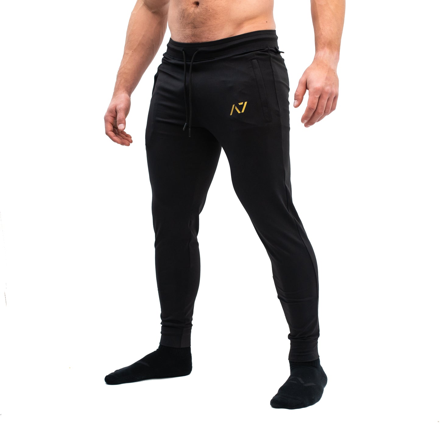 Gold Standard Defy joggers are just as comfortable in the gym as they are going out. These are made with premium moisture-wicking 4-way-stretch material for greater range of motion. These are a great fit for both men and women and offer deep zippered pockets and tapered leg design. Purchase Gold Standard Defy Joggers from A7 UK shipping to UK or A7 Europe shipping to EU.