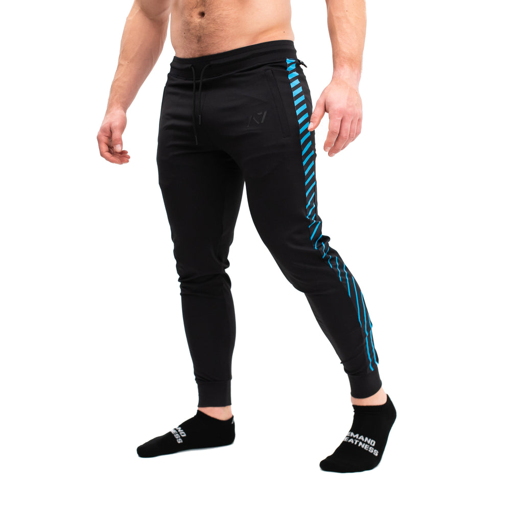 A7 Ripple Defy joggers are just as comfortable in the gym as they are going out. These are made with premium moisture-wicking 4-way-stretch material for greater range of motion. These are a great fit for both men and women and offer deep zippered pockets and tapered leg design. Purchase Ripple Defy Joggers from A7 UK shipping to UK or A7 Europe shipping to EU.
