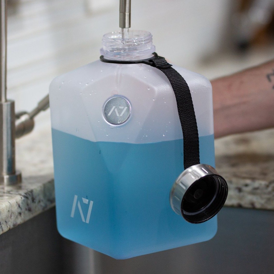 Stay hydrated during your workout with an A7 Water Jug. The jug is great for long workouts. It features a magnetic phone attachment so you can keep your phone close while you workout.  Simply stick the magnet on the back of the phone and pop the phone onto the bottle and your are ready to record your next set or even watch a video.