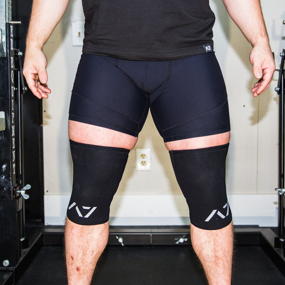 
                      
                        A7 IPF approved Black CONE knee sleeves are structured with a downward cut panel on the back of the quad and calf to ensure ultimate compression at the knee joint. A7 CONE knee sleeves are IPF approved for use in all powerlifting competitions. A7 CONE Knee Sleeves are IPF Approved Kit. A7 cone knee sleeves are made with high quality neoprene and the knee sleeves are sold as a pair. The double seam on the knee sleeves create a greater tension on the knee joint. A7 UK shipping to UK and Europe. 
                      
                    
