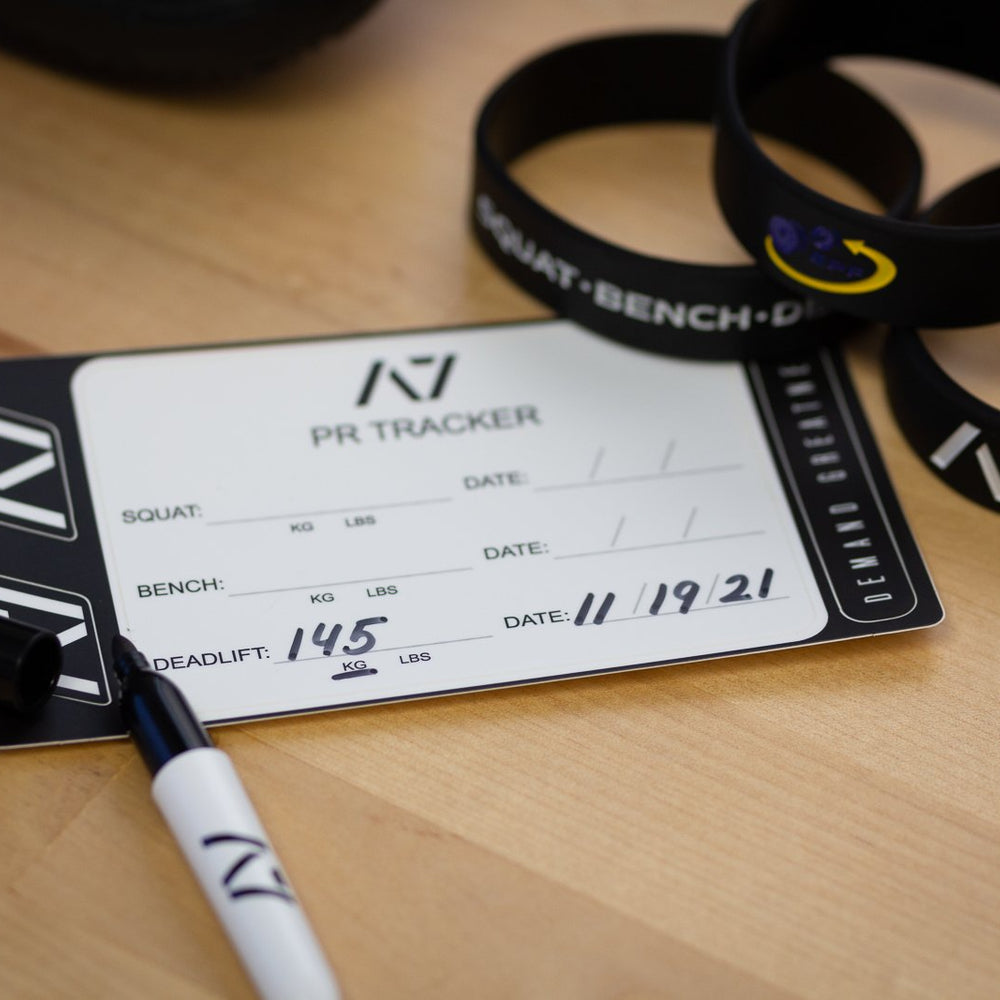
                      
                        A7 PR Tracker sheet was designed to allow you to document your PRs and progress in your training of Squat, Bench and Deadlift in a convenient sheet that you can attach to your belt, your gym banner or even your home gym wall. It include a small A7 Permanent marker with a keyring to help document our success along with 2 A7 stickers and 1 Demand Greatness sticker.
                      
                    