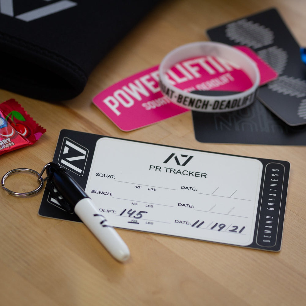 
                      
                        A7 PR Tracker sheet was designed to allow you to document your PRs and progress in your training of Squat, Bench and Deadlift in a convenient sheet that you can attach to your belt, your gym banner or even your home gym wall. It include a small A7 Permanent marker with a keyring to help document our success along with 2 A7 stickers and 1 Demand Greatness sticker.
                      
                    
